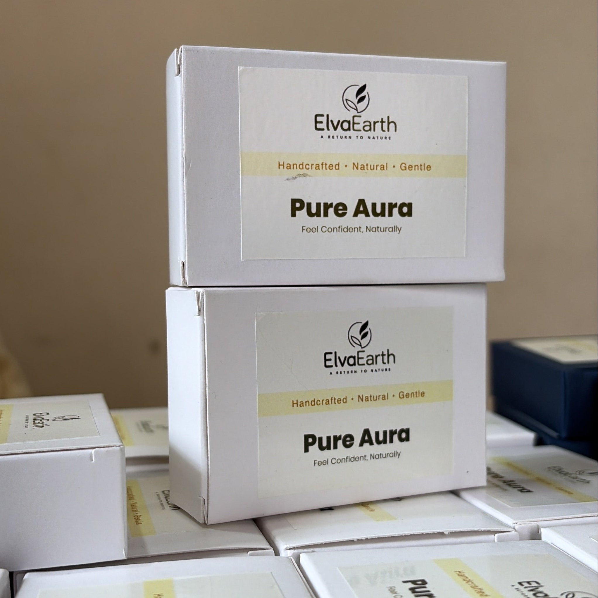 Boxes of 'Pure Aura' products on a shelf with a neutral background
