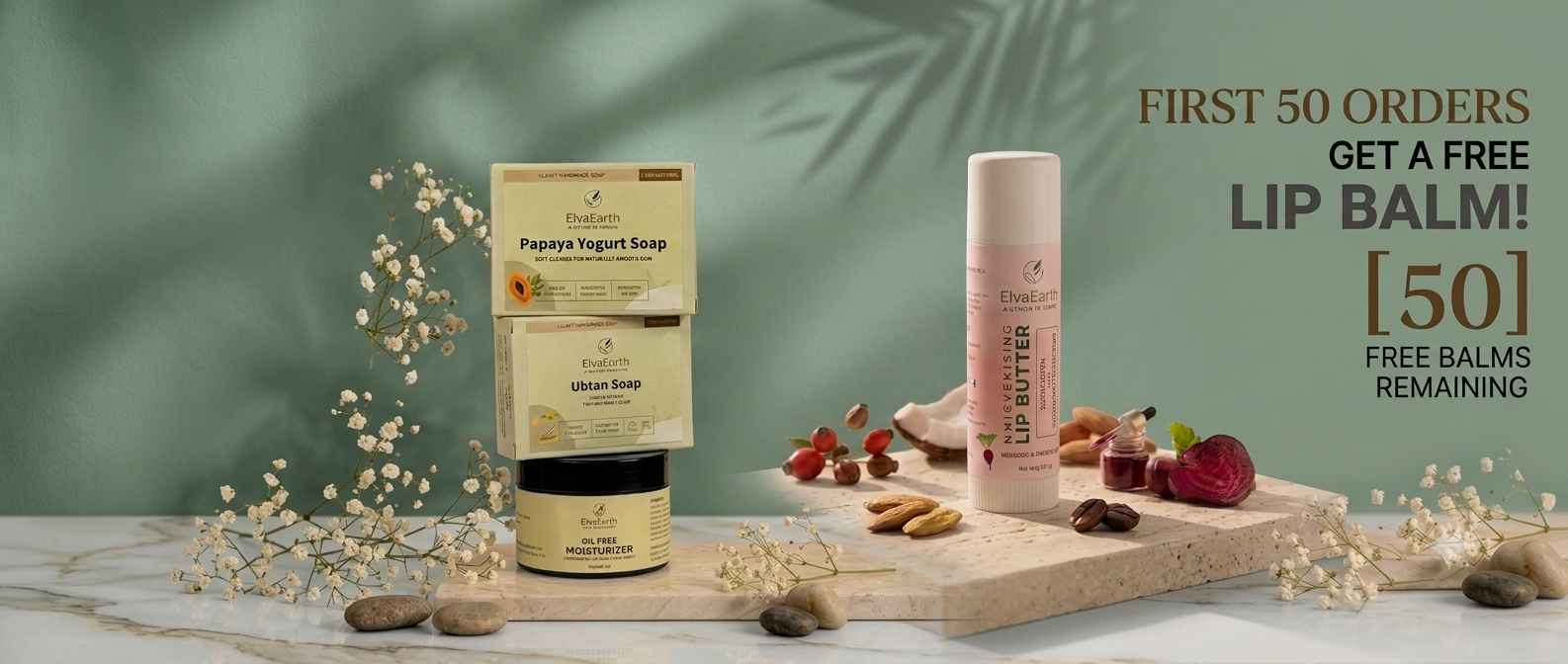 A cosmetic product display featuring a jar of Breathe Natural Pigeon Yogurt Soap and a tube of lip balm on a marble surface with decorative dried flowers and nuts. Text on the right reads 'FIRST 50 ORDERS GET A FREE LIP BALM [50] FREE BALMS REMAINING'.