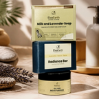 ElvaEarth Milk and Lavender Soap and Radiance Bar set, stacked in two vertical pairs on a wooden surface with bath stones, dried lavender, and a soap dispenser in the background.